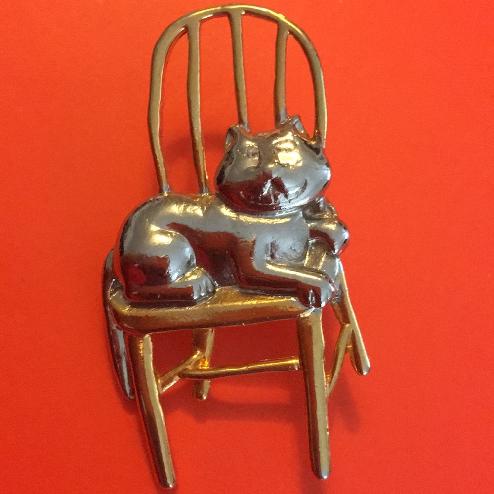 Vintage JJ cat sitting on a chair brooch